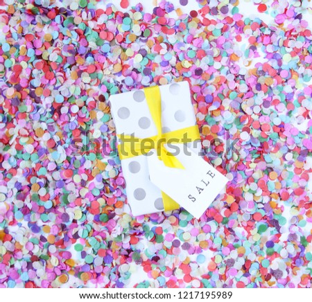boxes with gifts, colorful background, confetti, the inscription sale
