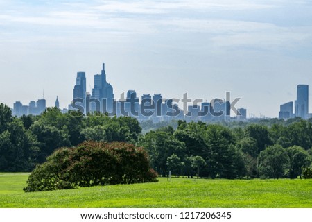 A view of the hazy Philadelphia skyline from a distance.