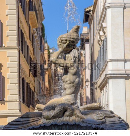 fountain of the God Triton in Piazza Barberini, Rome Italy. Made by Bernini Royalty-Free Stock Photo #1217210374