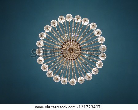 The image of the chandelier in the style of Art Nouveau.  Unique classical empire chandelier. Modern style background for a monitor. 