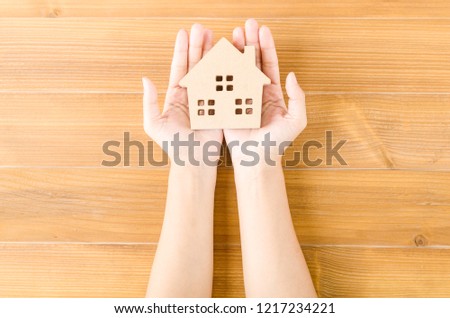 Home idea in human hand dream to sweet family