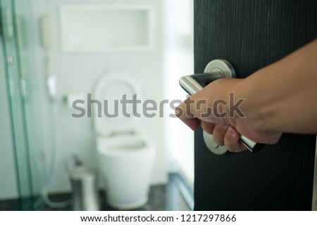 open the bathroom door, go to toilet
 Royalty-Free Stock Photo #1217297866
