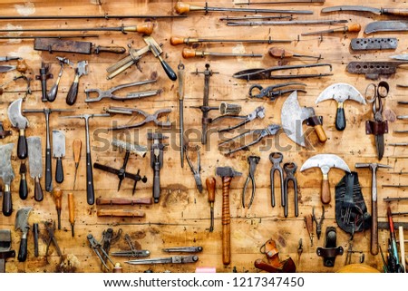 vintage tools on old wooden background