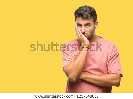Young handsome man over isolated background thinking looking tired and bored with depression problems with crossed arms.
