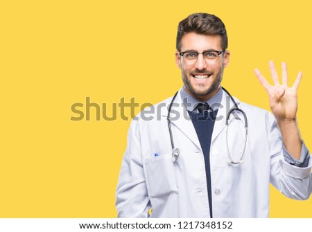 Young handsome doctor man over isolated background showing and pointing up with fingers number four while smiling confident and happy.