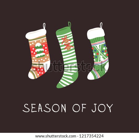 Hand drawn set of Cozy Christmas socks for gifts on dark background. Happy Holidays greeting  card. Funny cartoon drawing and text. Vector art illustration