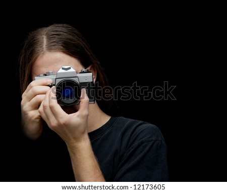 Photographer holding an old film camera