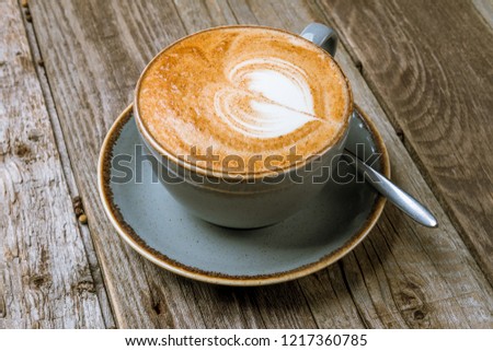 Cappuccino coffee with heart drawing