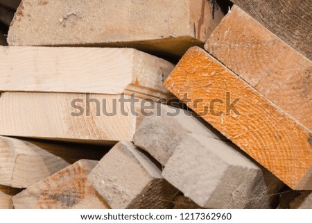 Background tree. Closeup of wooden planks. Tree in the cut. Many boards