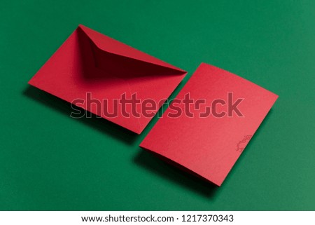 Blank red card with red paper envelope Christmas card template mock up.
