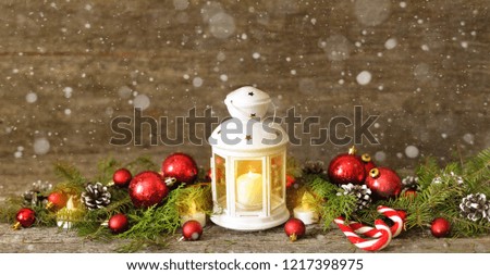 Long banner Christmas composition with Shining lights. Red balls, Pine cones, lollipop on Wooden Table