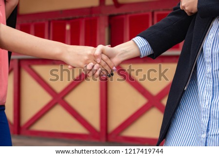 Close up of high five hand gesture, symbol of common celebration or greeting. Success and teamwork concept