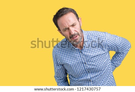 Handsome middle age elegant senior man over isolated background Suffering of backache, touching back with hand, muscular pain
