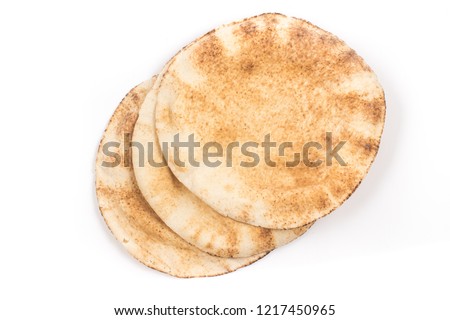 Flatbreads. Arab Bread isolated on white background Royalty-Free Stock Photo #1217450965