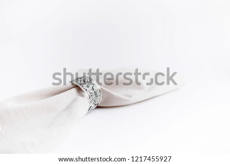 Iron napking holder with  fruit pattern. Napkin in a napkin holder on a white isolated background close - up. 