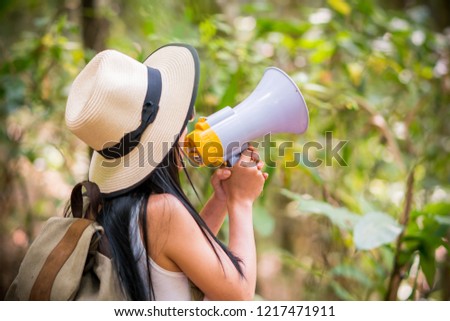 Asian young pretty girl with megaphone traveler attractive adventure wilderness.
