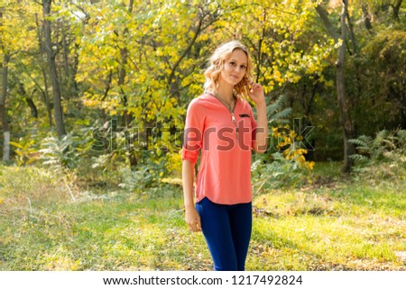 Autumn woman portrait outdoors at the park