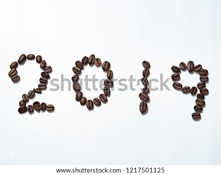 Numeral 2019 from coffee beans, isolated on white background 