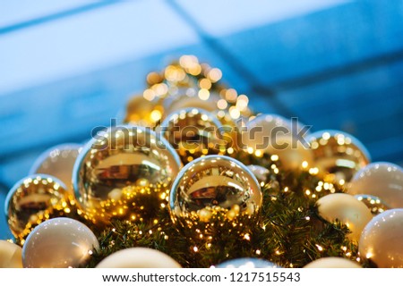 Full Frame Shot Of Pine Tree. A Christmas bauble hangs from a tree. A Christmas bauble hangs from a tree.