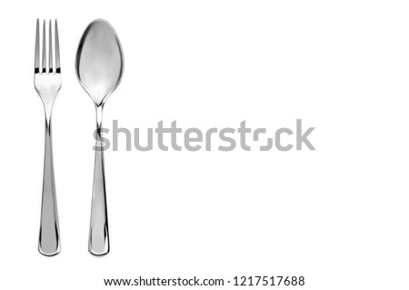 A top down view on a cutlery in white background Royalty-Free Stock Photo #1217517688
