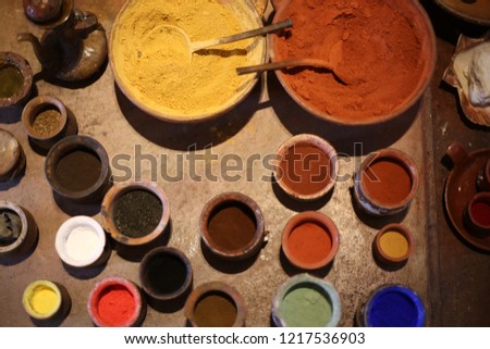 Bowls with pigment powder in a workshop of an artist