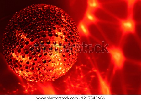 Red Christmas ornament stock images. Christmas balls on a red background. Elegant holiday background. Shiny red backdrop with Christmas ball