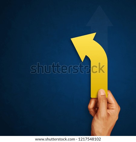 Businessman is holding arrow of decision as a symbol of choice and success. Concept of decision making and choices success in the future goal
