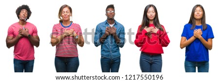 Composition of african american, hispanic and chinese group of people over isolated white background smiling with hands on chest with closed eyes and grateful gesture on face. Health concept.
