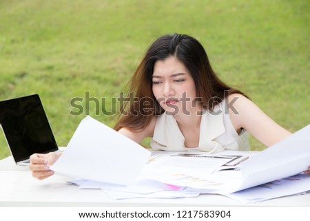 bored woman sitting at the table.Overworked and tired young woman sleeping on desk.