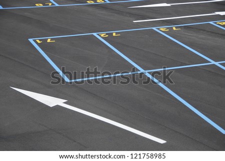 Empty parking places. All of them are numbered and painted in blue