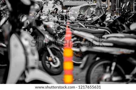 Motorcycles parked Over limit  barrier on the road.