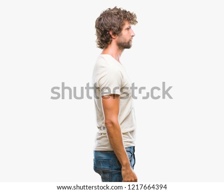Handsome hispanic model man over isolated background looking to side, relax profile pose with natural face with confident smile.