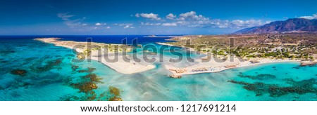 Elafonissi beach on Crete island with azure clear water, Greece, Europe. Crete is the largest and most populous of the Greek islands.  Royalty-Free Stock Photo #1217691214