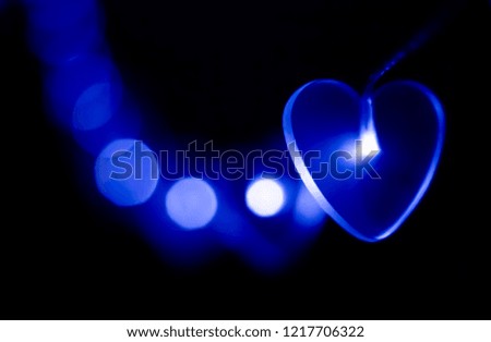 Glowing Christmas garland in the shape of hearts 