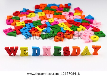 The word wednesday with colored letters