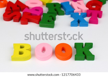 The word book with colored letters