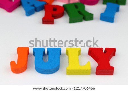 The word july with colored letters