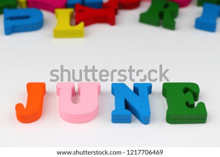 The word june with colored letters