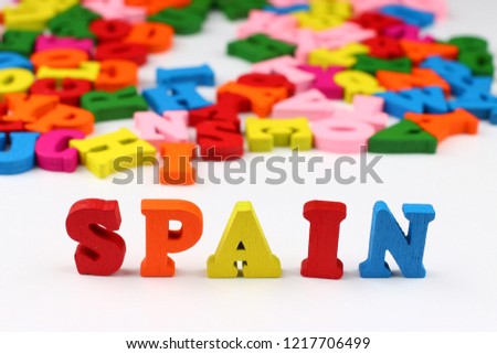 The word spain with colored letters