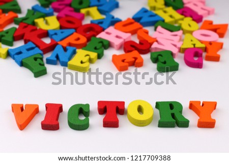 The word victory with colored letters