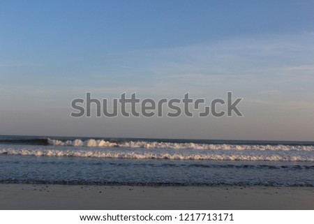 Surfing in the beach