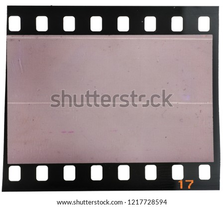 Old and grungy 35mm film frame or dia film strip on white with scratches, dust and grain on the image area, just place your picture here