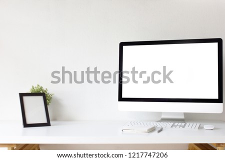Office table desk. Workspace with blank computer screen, keyboard, mouse, booklet, pen, empty picture frame, plant mockup and white background front view