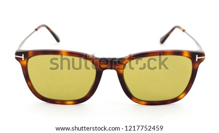 Yellow glasses with leopard print on a white background side view
