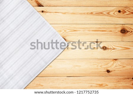 Old vintage wooden table with white tablecloth. Top view mock up.