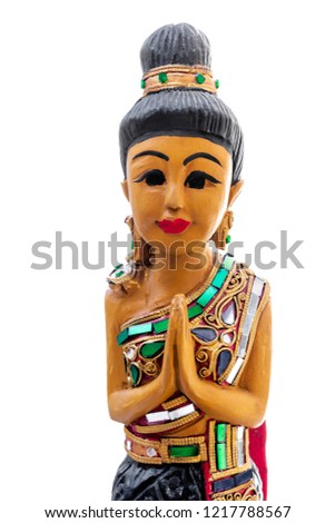 Ancient and colorful religious statue praying with hands together on white background. Namaste, karma, yin yang, yoga.