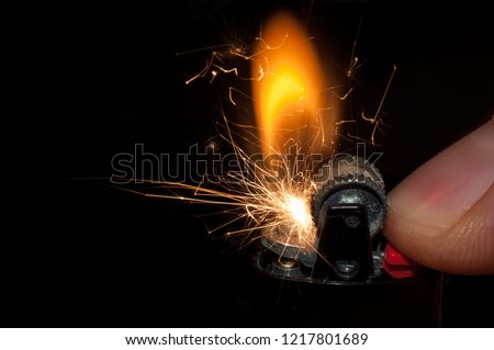 The moment of ignition and spark of an old lighter