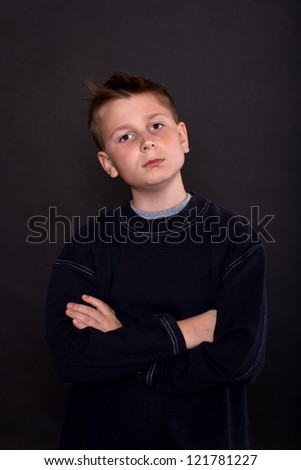 portrait of teenage boy on a black background