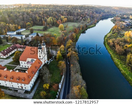 River, church and forest view in Autumn