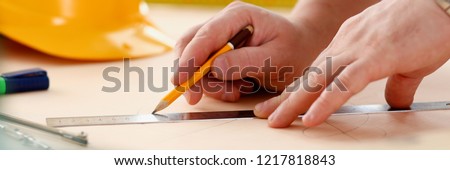 Arms of worker making structure plan on scaled paper closeup. Manual job DIY inspiration improvement job fix shop graphic joinery startup workplace idea designer career industrial education